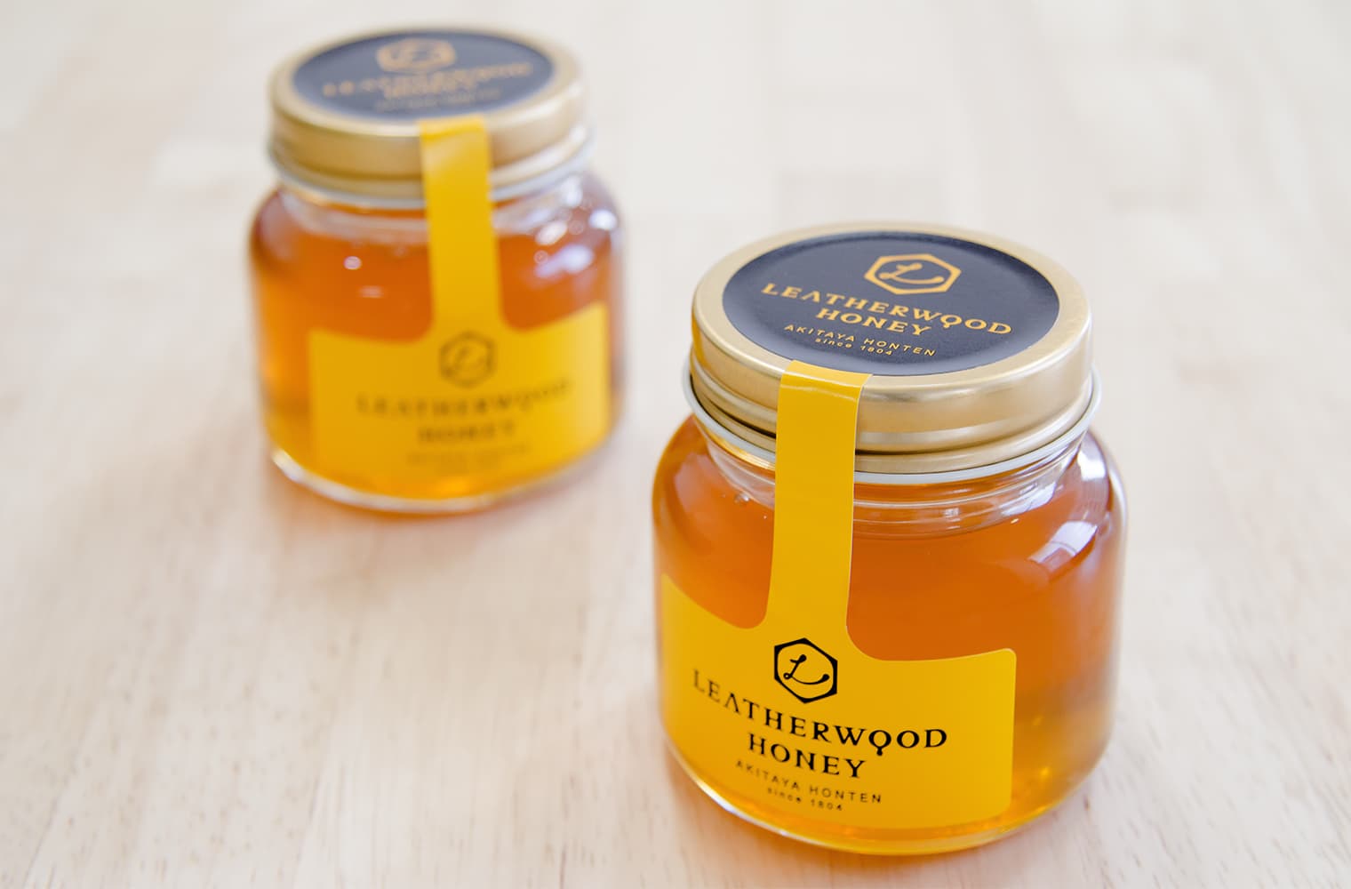 株式会社秋田屋本店 レザーウッドハニー ラベルデザイン